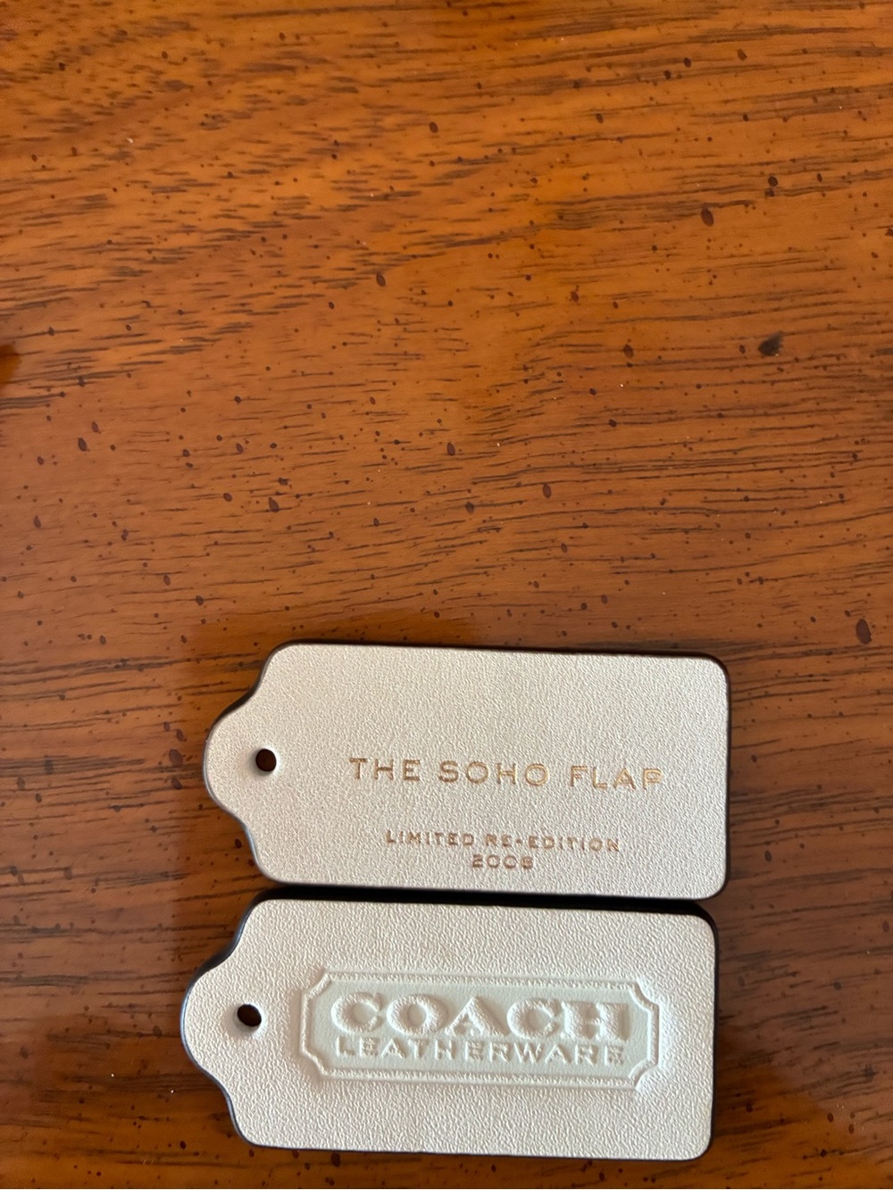 Coach Leatherware The Soho Flap Bag Tags in Cream colored leather Adjustable